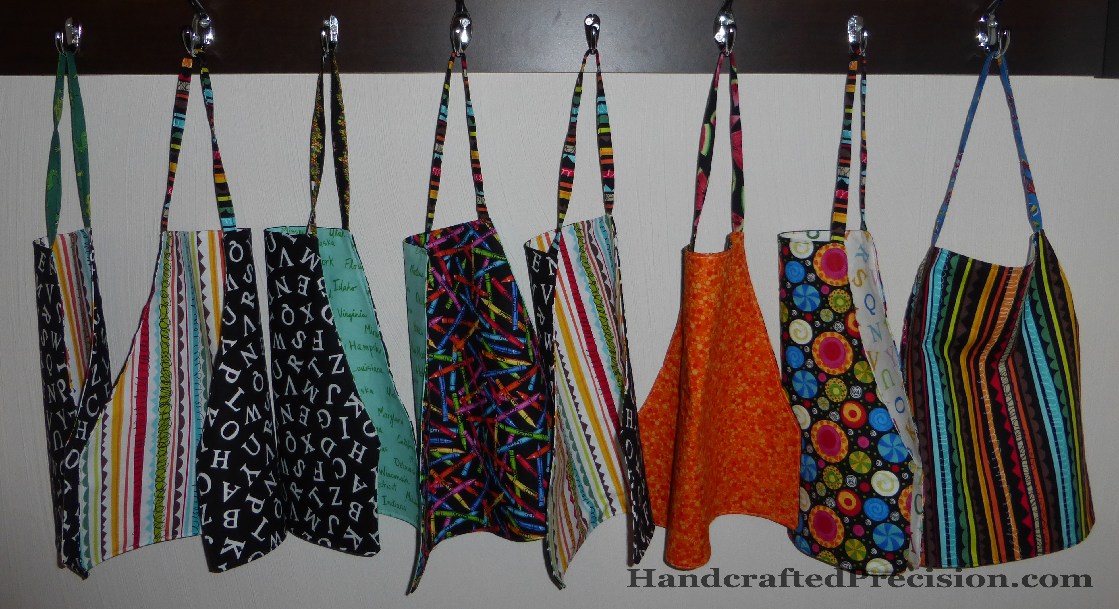 Finished Toddler Aprons Hanging HP